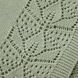 Manta tejida verde musgo