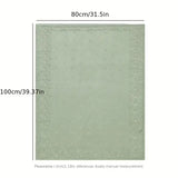 Manta tejida verde musgo